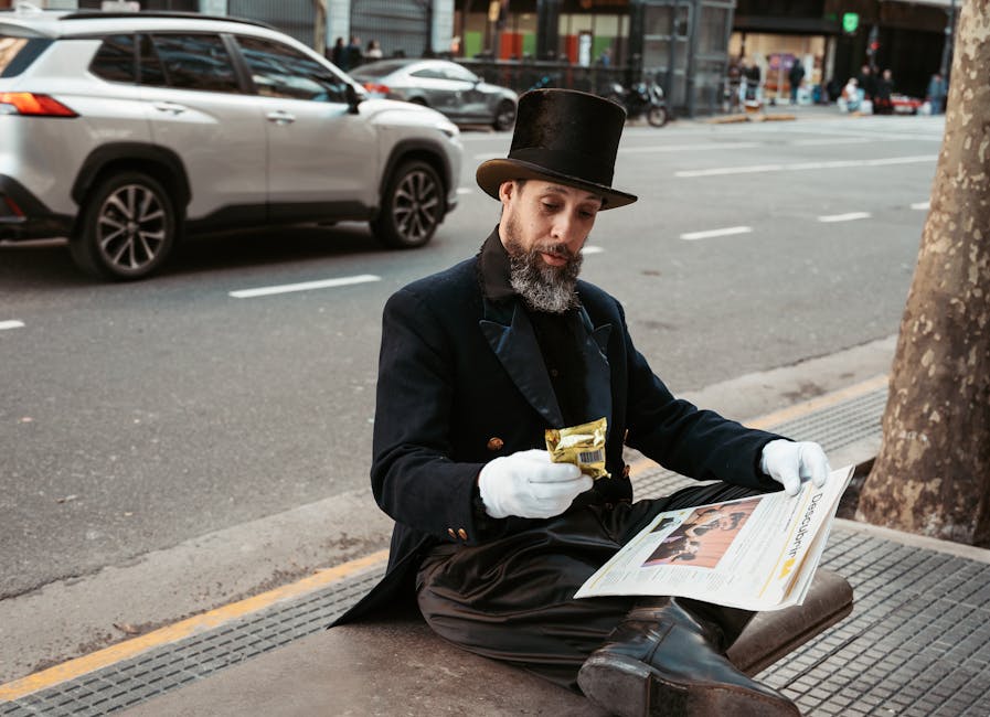 A man dressed in vintage attire reads a newspaper on the streets of Buenos Aires, Argentina.